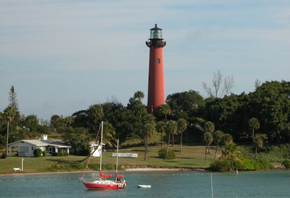 View of historic red lighthouse in Jupiter, FL from Loxahatchee River